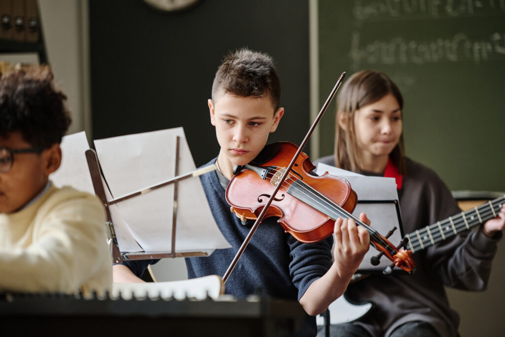 Boy Playing Violin School Orchestra 1024x683